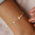 Pulsera/tobillera con cruz de inspiración religiosa