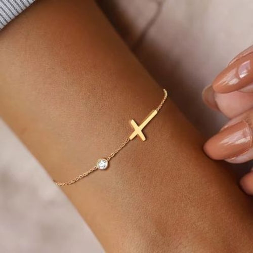 Pulsera/tobillera con cruz de inspiración religiosa